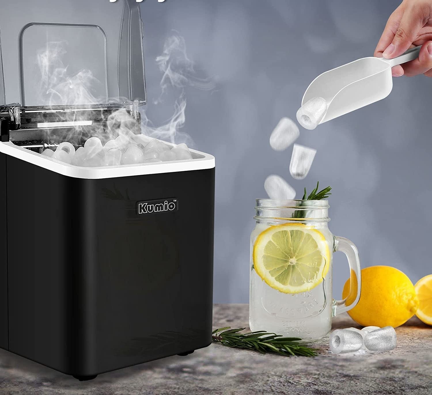 the ice machine next to a glass of lemon water that someone is pouring ice cubes into