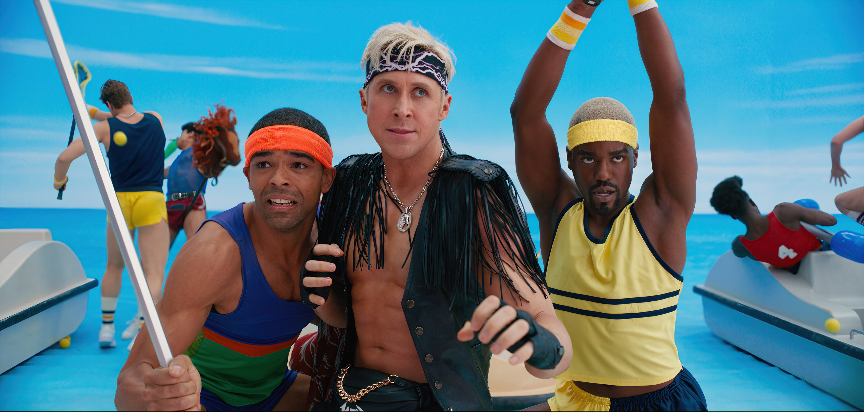 The three in different costumes, including tank tops, a vest with tassels, and headbands