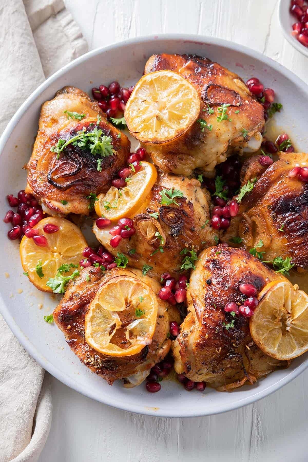 Pomegranate chicken thighs with lemon.