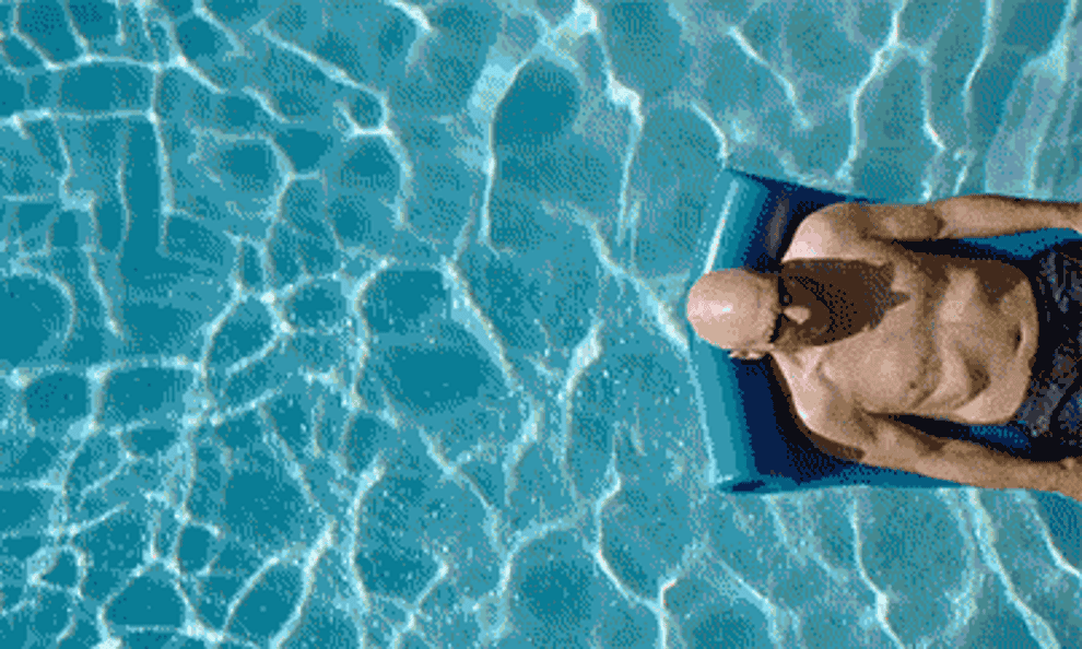 Man floating in pool