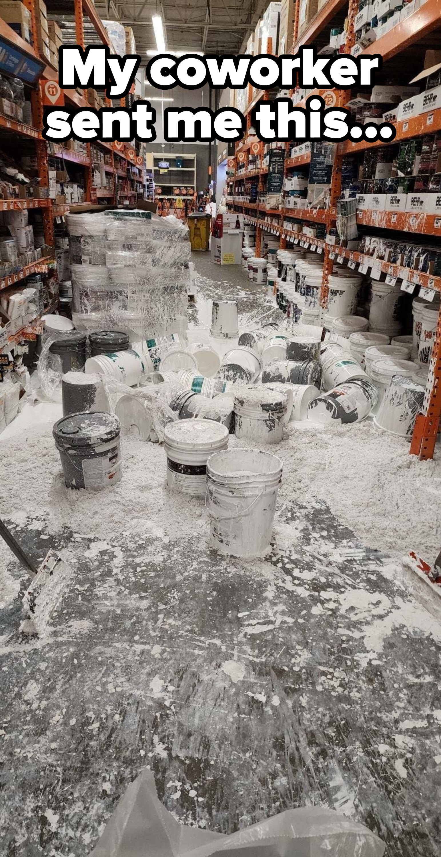 white paint buckets spilled all over the store aisle