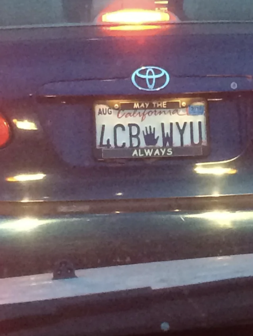 Car with license plate reading &quot;4CB WYU&quot;