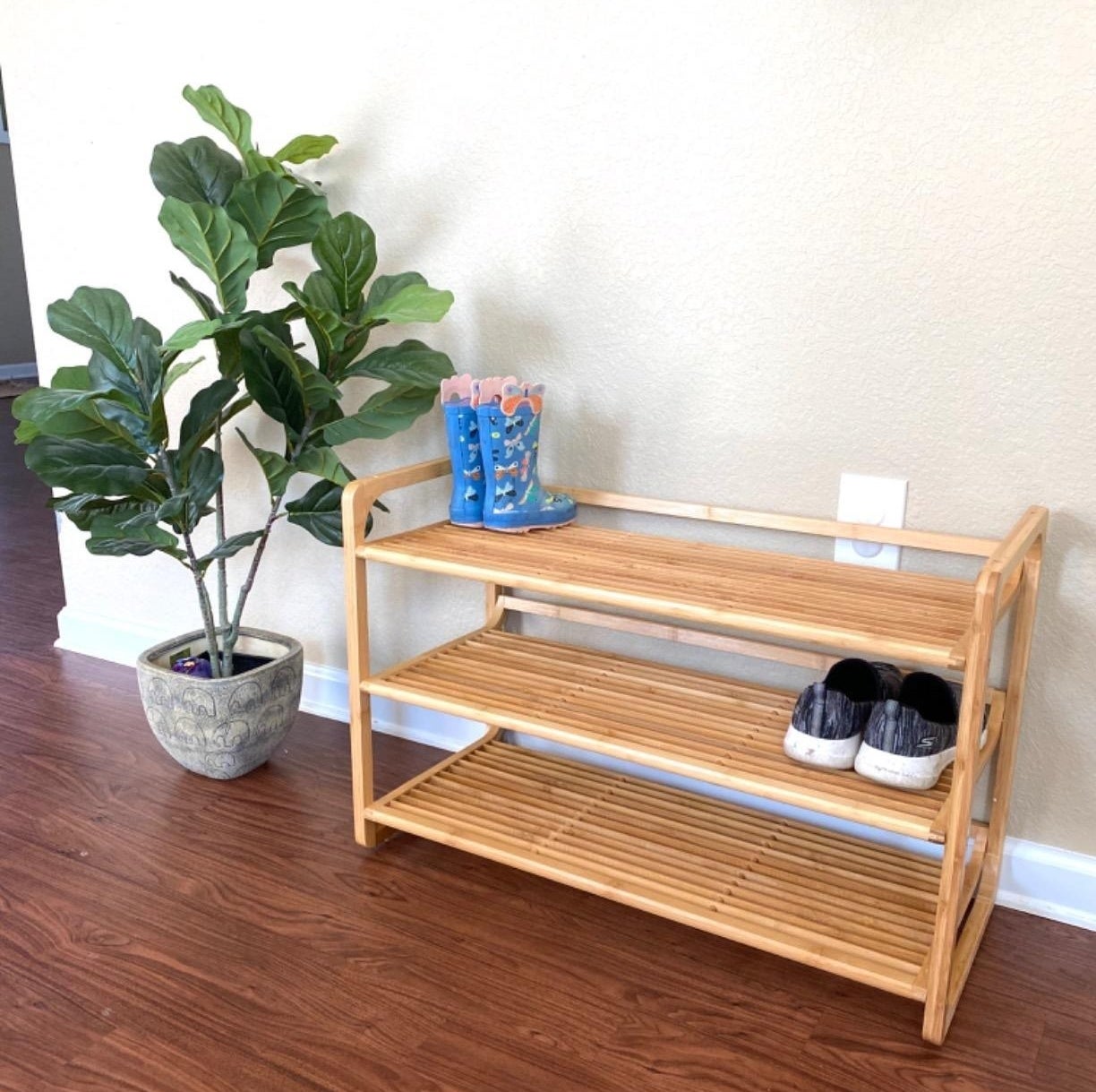 a reviewer photo of the shoe rack with shoes on it