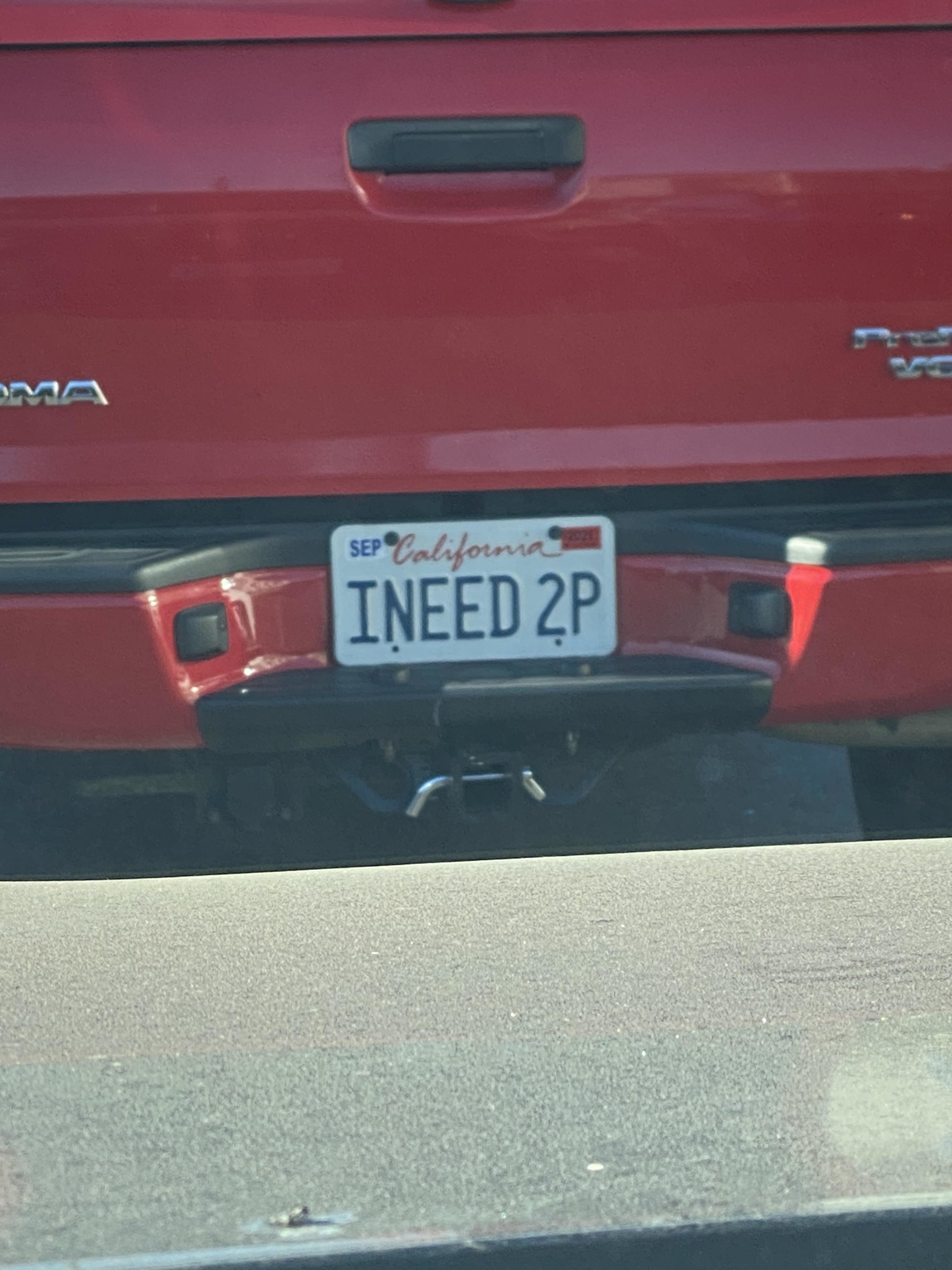 Car with license plate reading &quot;iNEED 2P&quot;