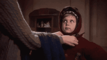 gif from a christmas story of Randy getting bundled up in coats by his mom