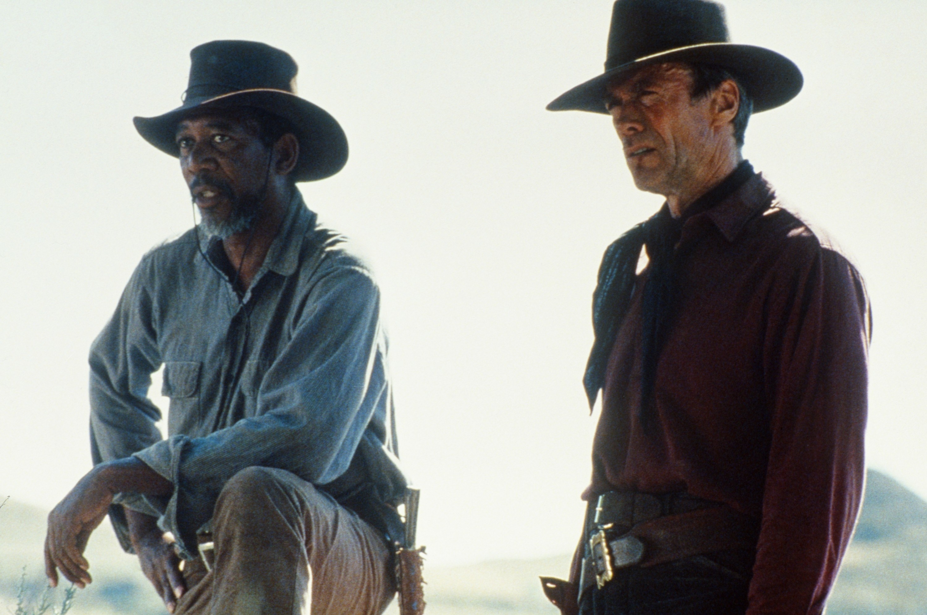 Morgan Freeman and Clint Eastwood wearing wide-brimmed hats