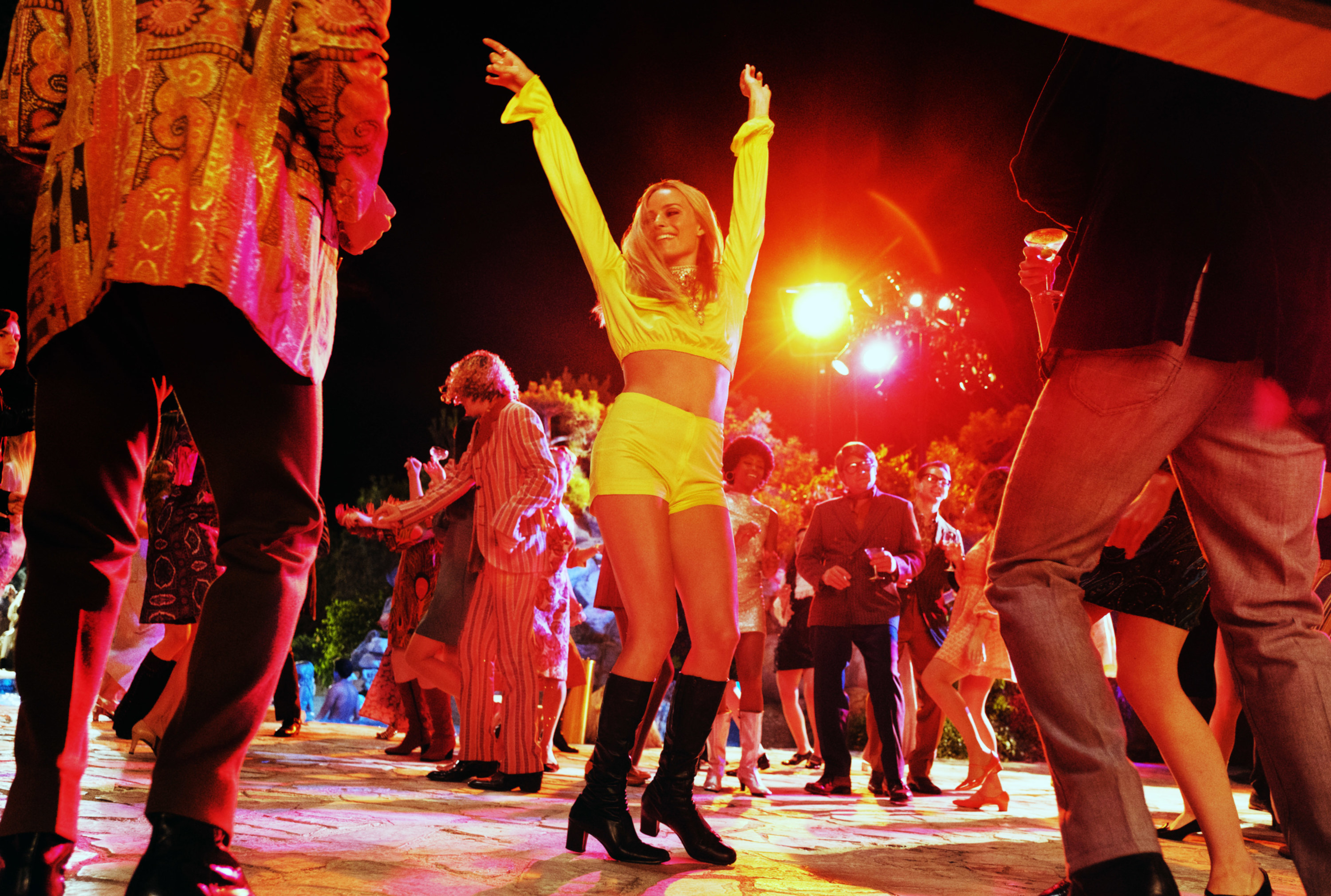 Margot Robbie dances on a dance floor