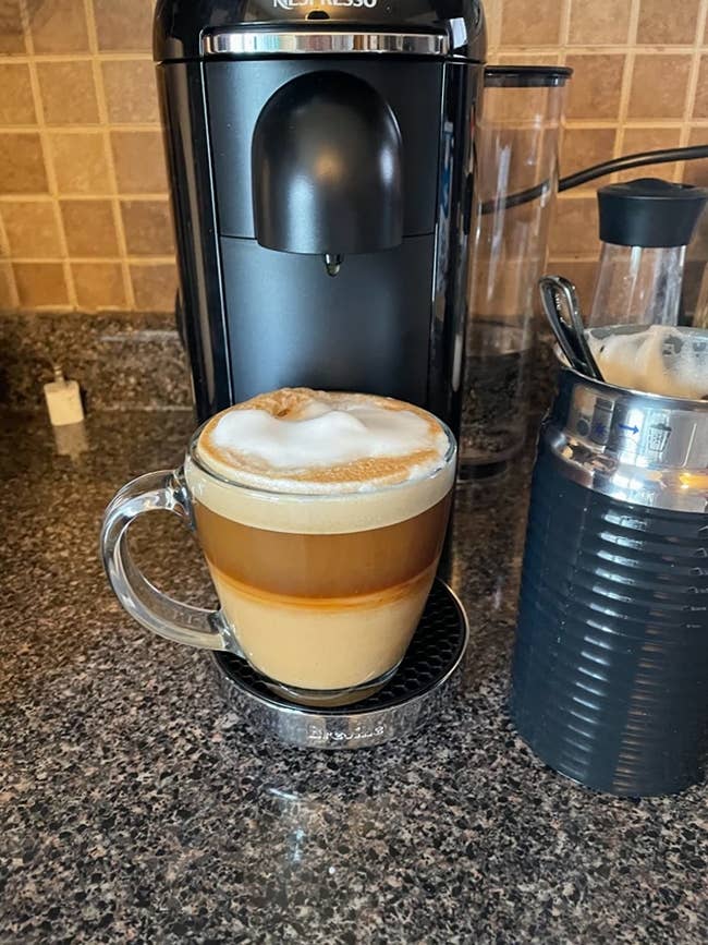 A reviewer's nespresso with a frothy coffee