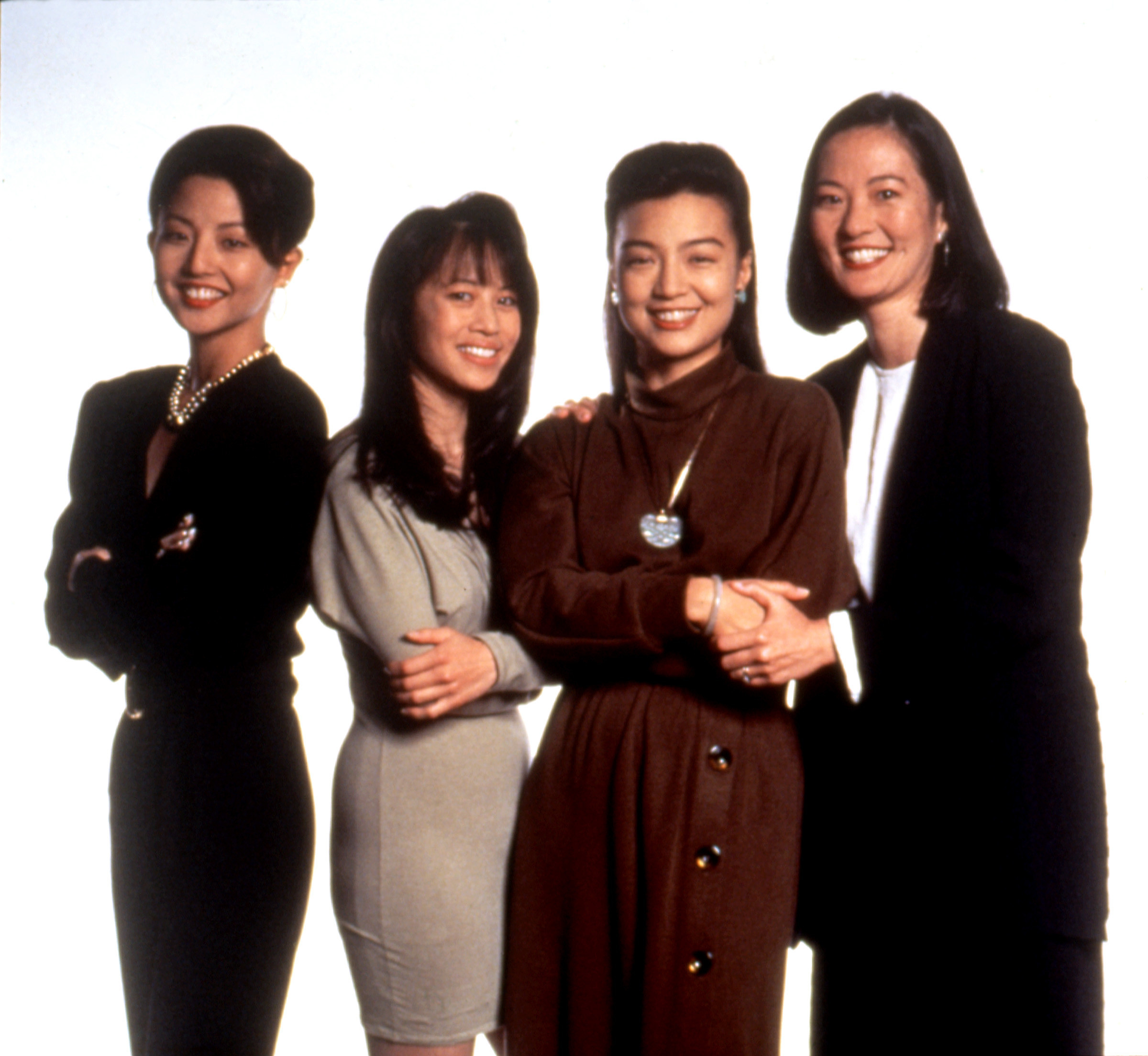 Four women, including Ming-Na Wen and Rosalind Chao, smiling and standing together