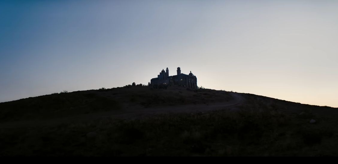 A giant mansion on an empty hill