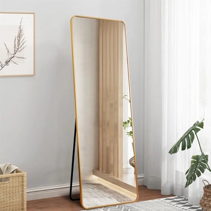 Gold trimmed standing rectangle mirror
