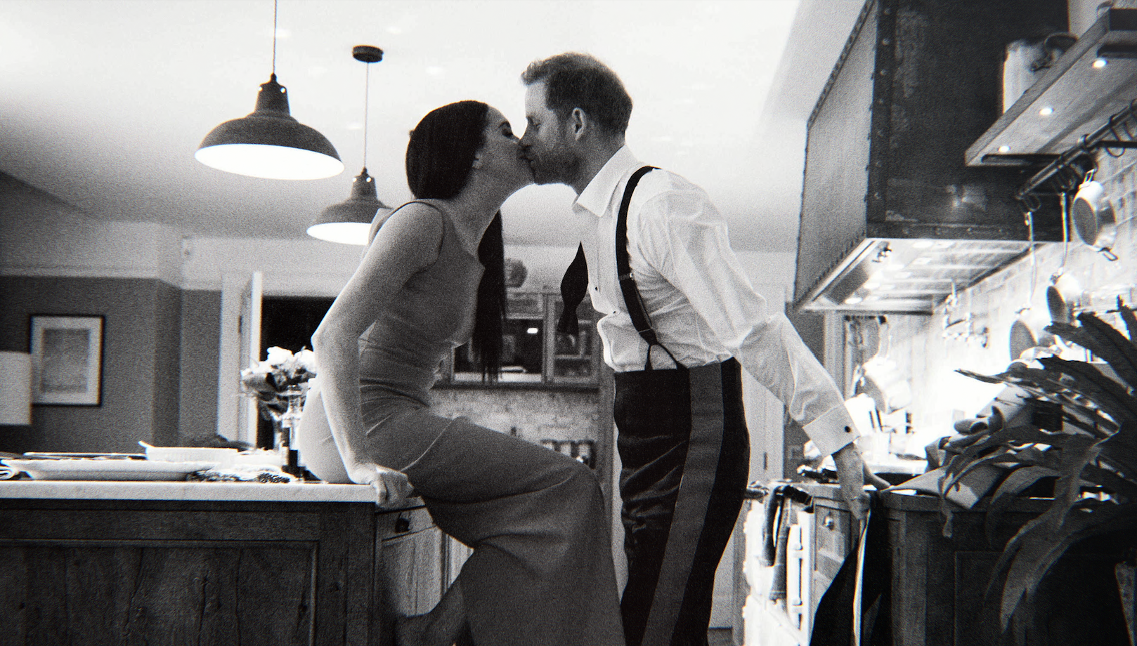 prince harry and meghan markle kissing in their kitchen