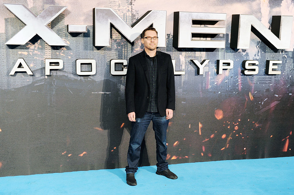 bryan in front of an xmen sign