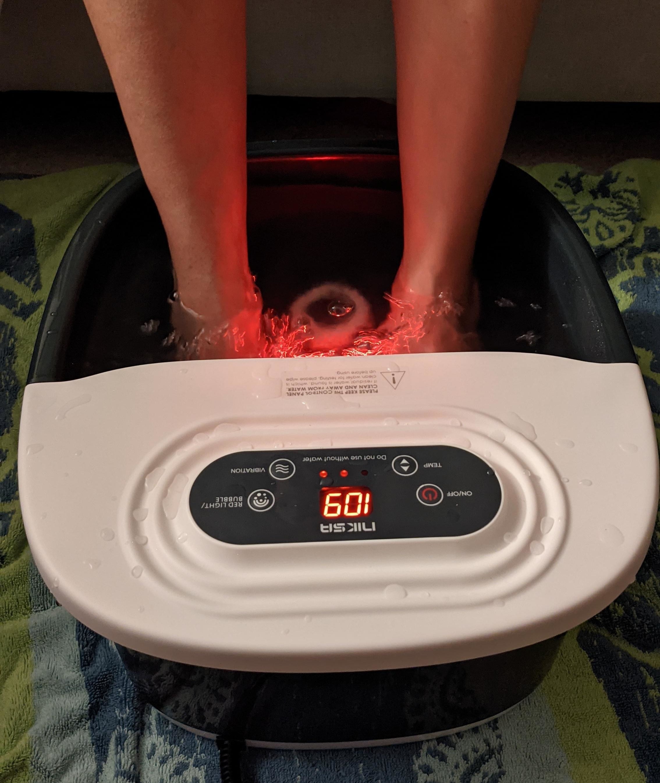 Reviewer soaking feet in the spa bath with temp set to 109