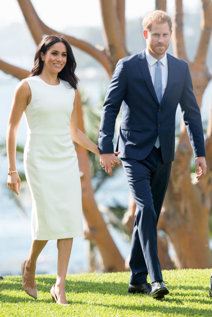 Meghan and Harry walking and holding hands