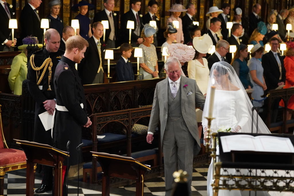 Prince Charles and Meghan standing together at the wedding