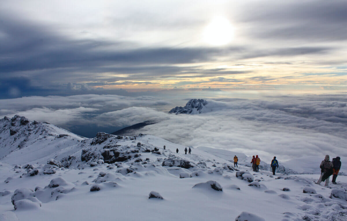 Climbers walking down Mt Kilimanjaro