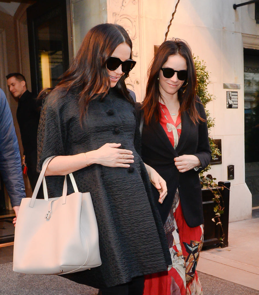 A pregnant Meghan with a friend