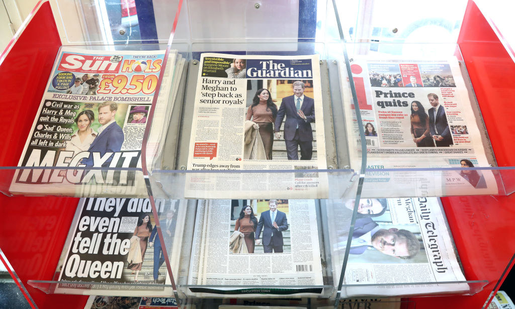 UK newspapers on display with Meghan and Harry headlines