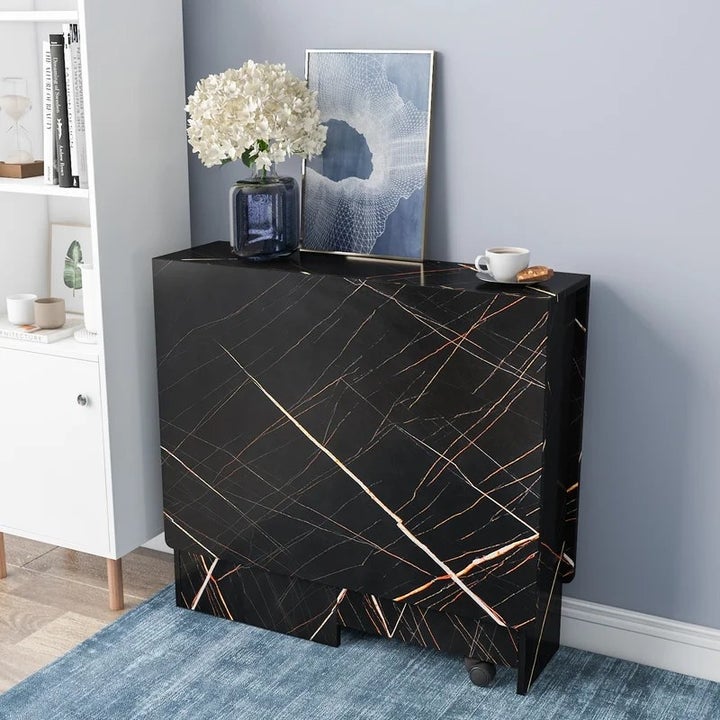Black marble table folded up