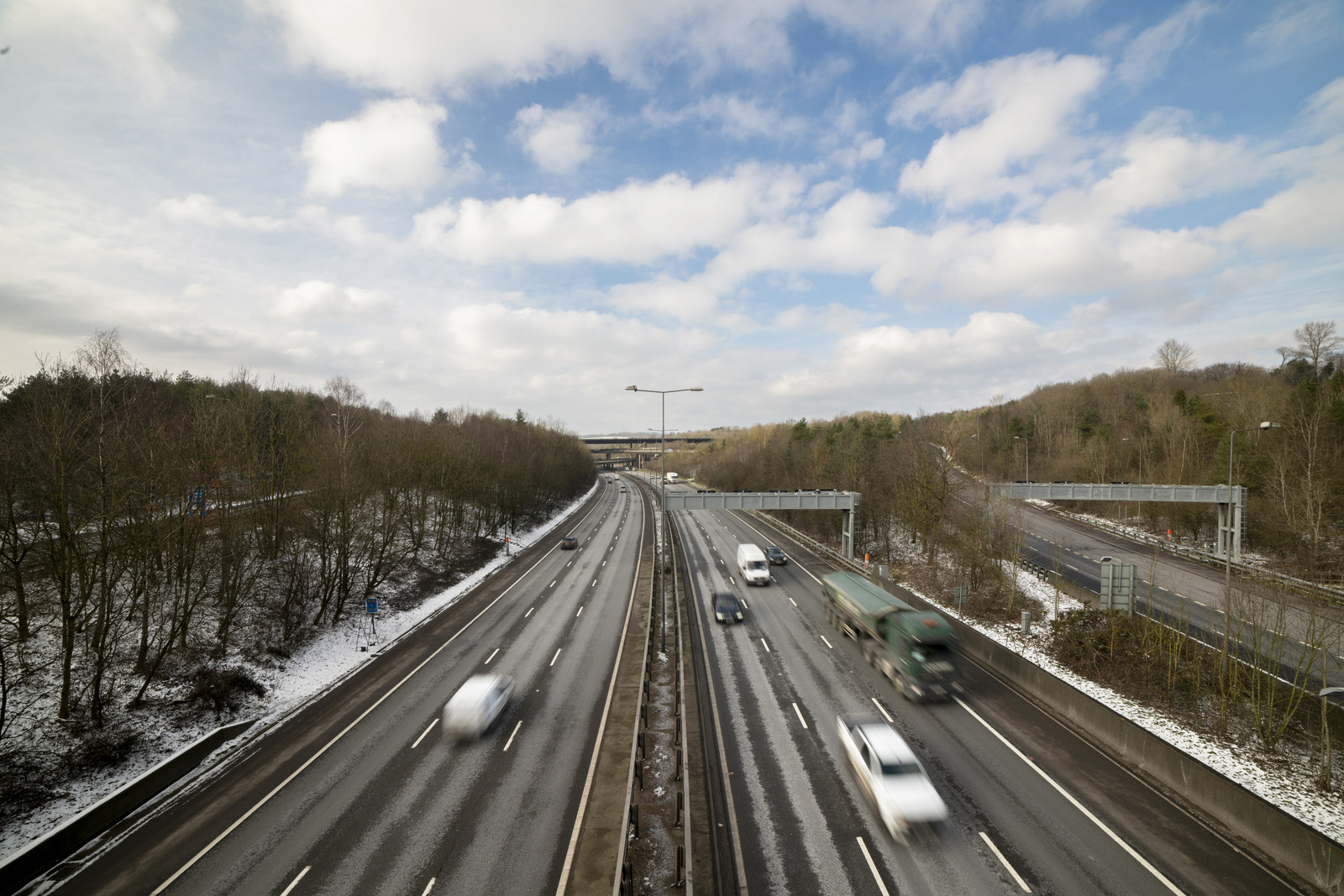 Wintery M25 with blurred vehicles driving along it