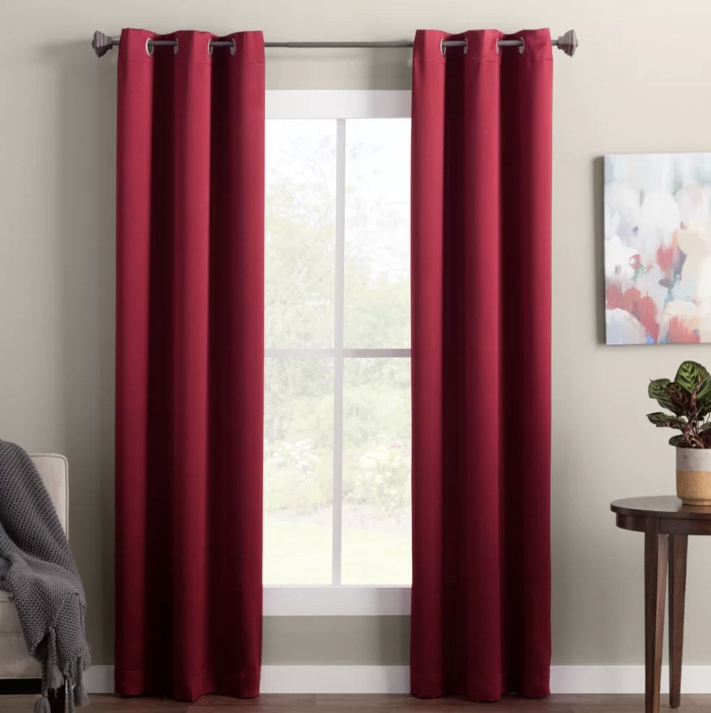 the red curtain panels framing window