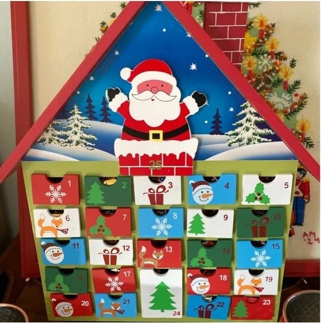 a reviewer photo of the house shaped advent calendar