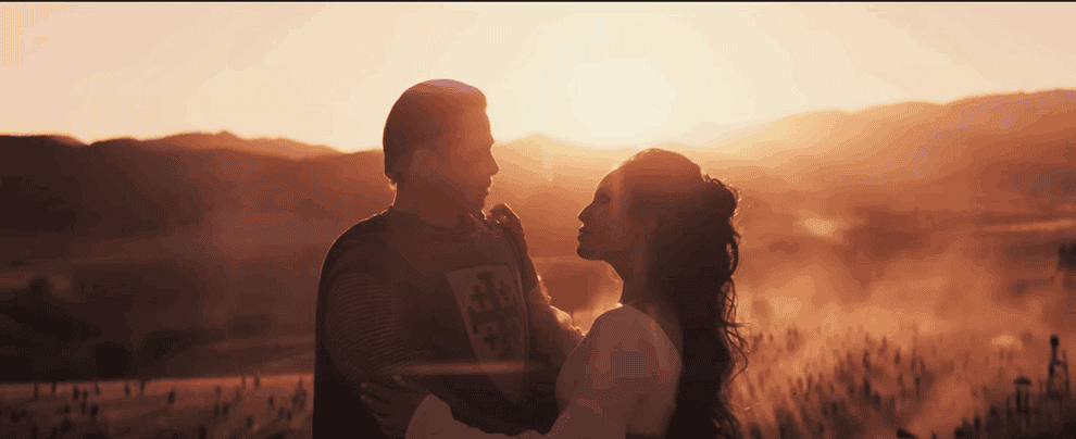 Movie gif: Brad Pitt wearing a knight&#x27;s costume and kissing a woman
