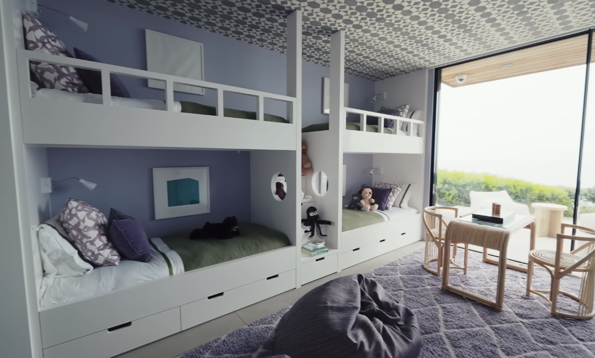four bunk beds in the kids room built into the wall