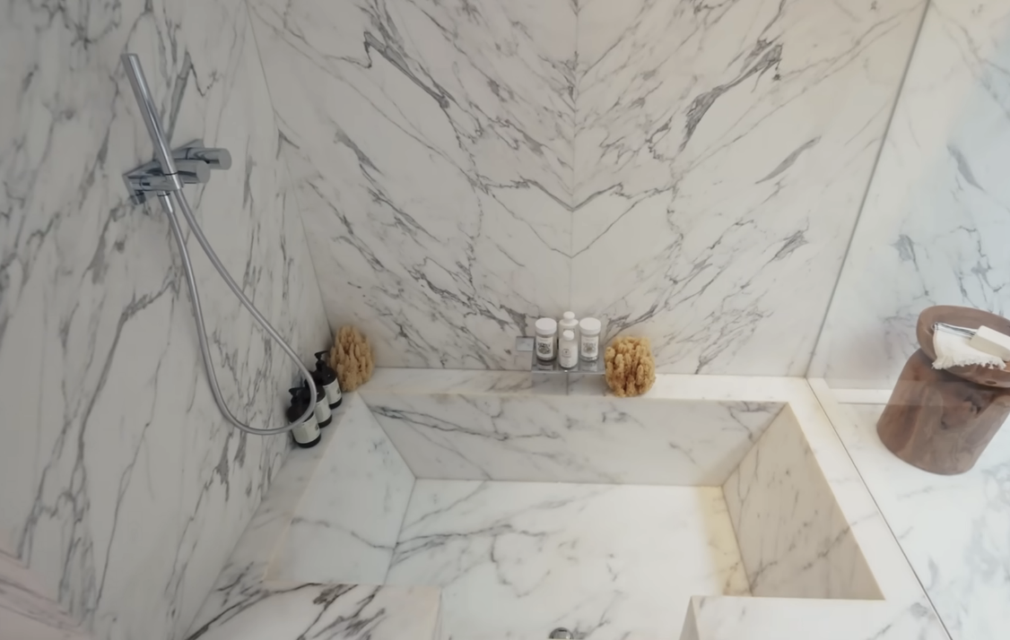 marble tub in the floor of the bathroom