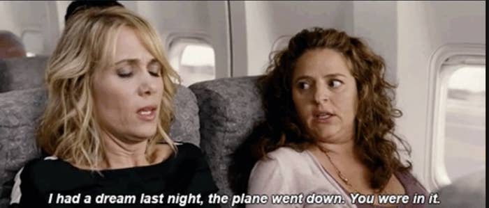 A woman saying to another on a plane, "i had a dream last night, the plane went down, you were in it"