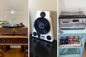 Reviewer image of wooden and clear turntable with black vinyl playing inside, white and black vertical turntable on top of black table, silver and black turntable radio on with clear lid on top of light blue side table