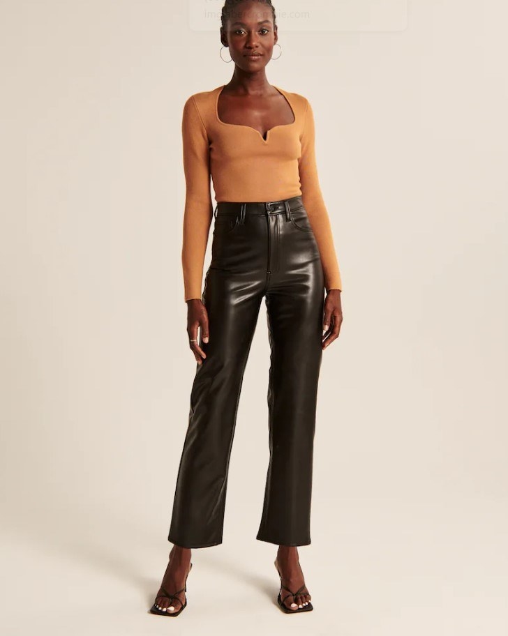 model wearing faux leather pants