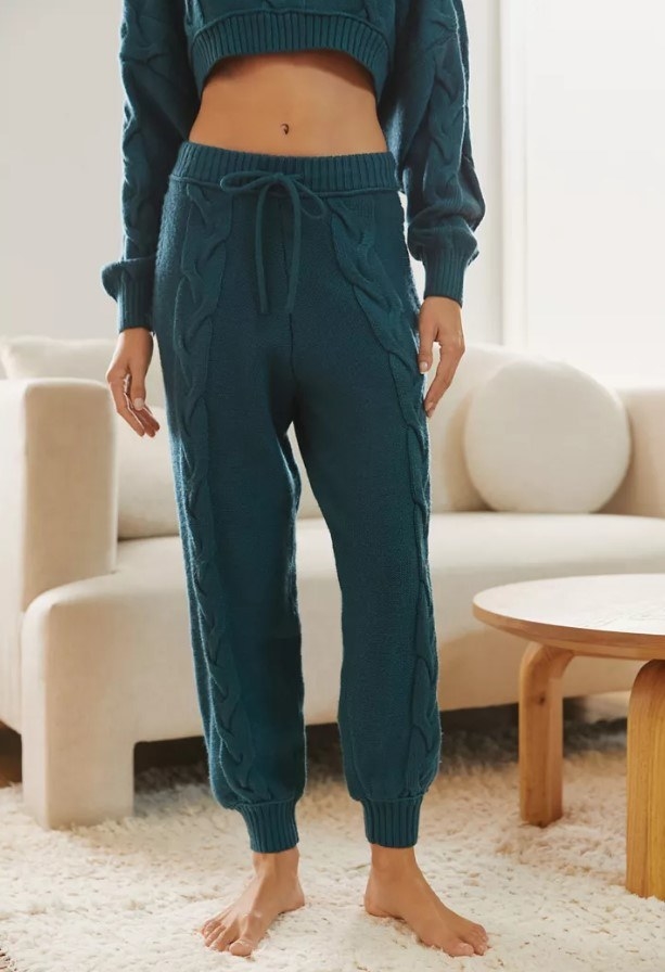 model wearing cable knit joggers