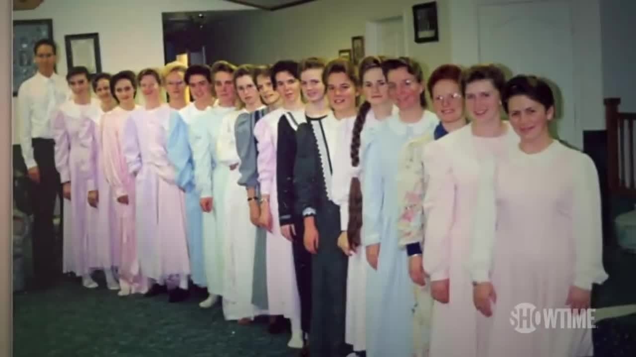 A man with a bunch of Mormon women