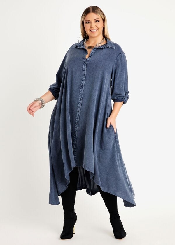 model in denim collared button-up midi and maxi dress with an asymmetrical hem