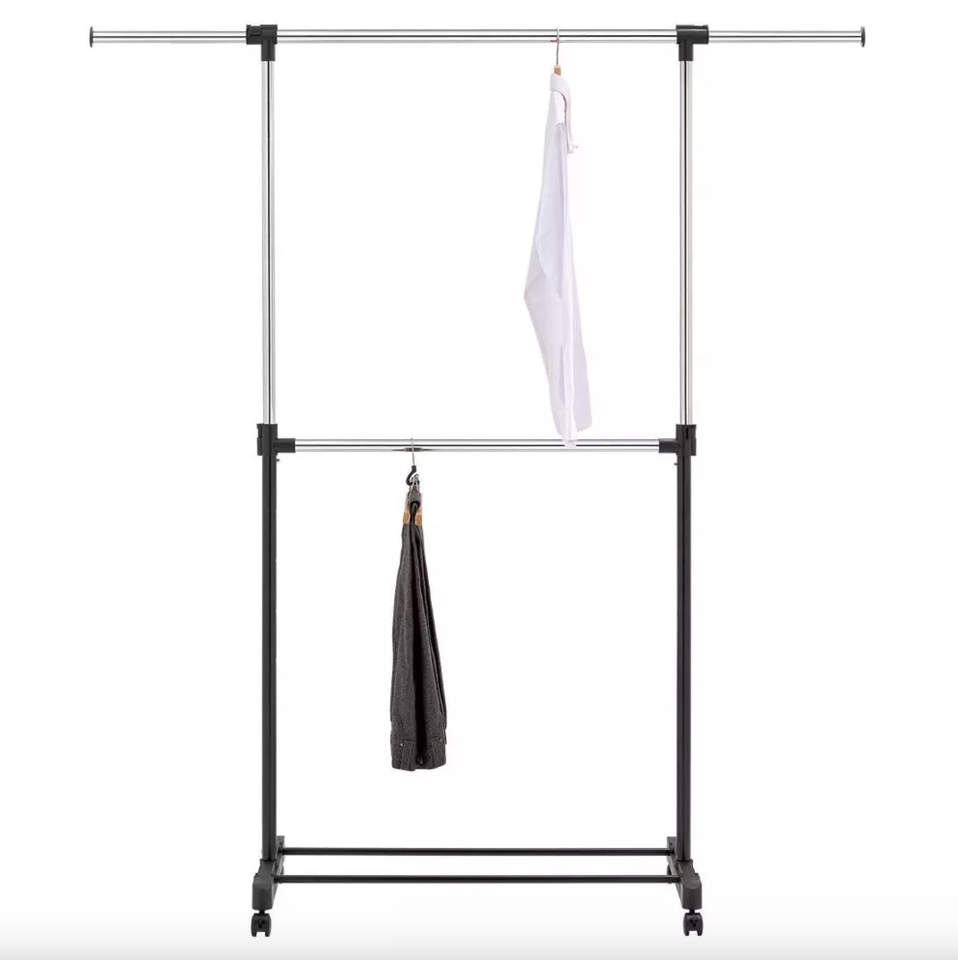 the silver and black rack with two levels. the bottom rail has a black pair of pants hanging on it and the top rail has a white shirt