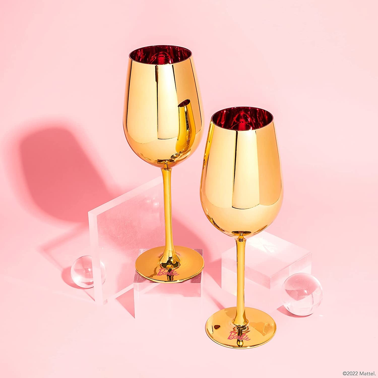 gold wine glass with pink on the inside