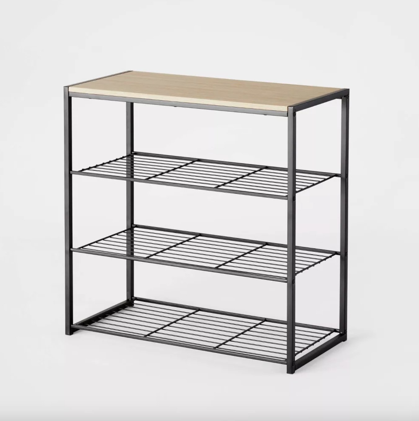 the black metal shoe rack with a light wooden top