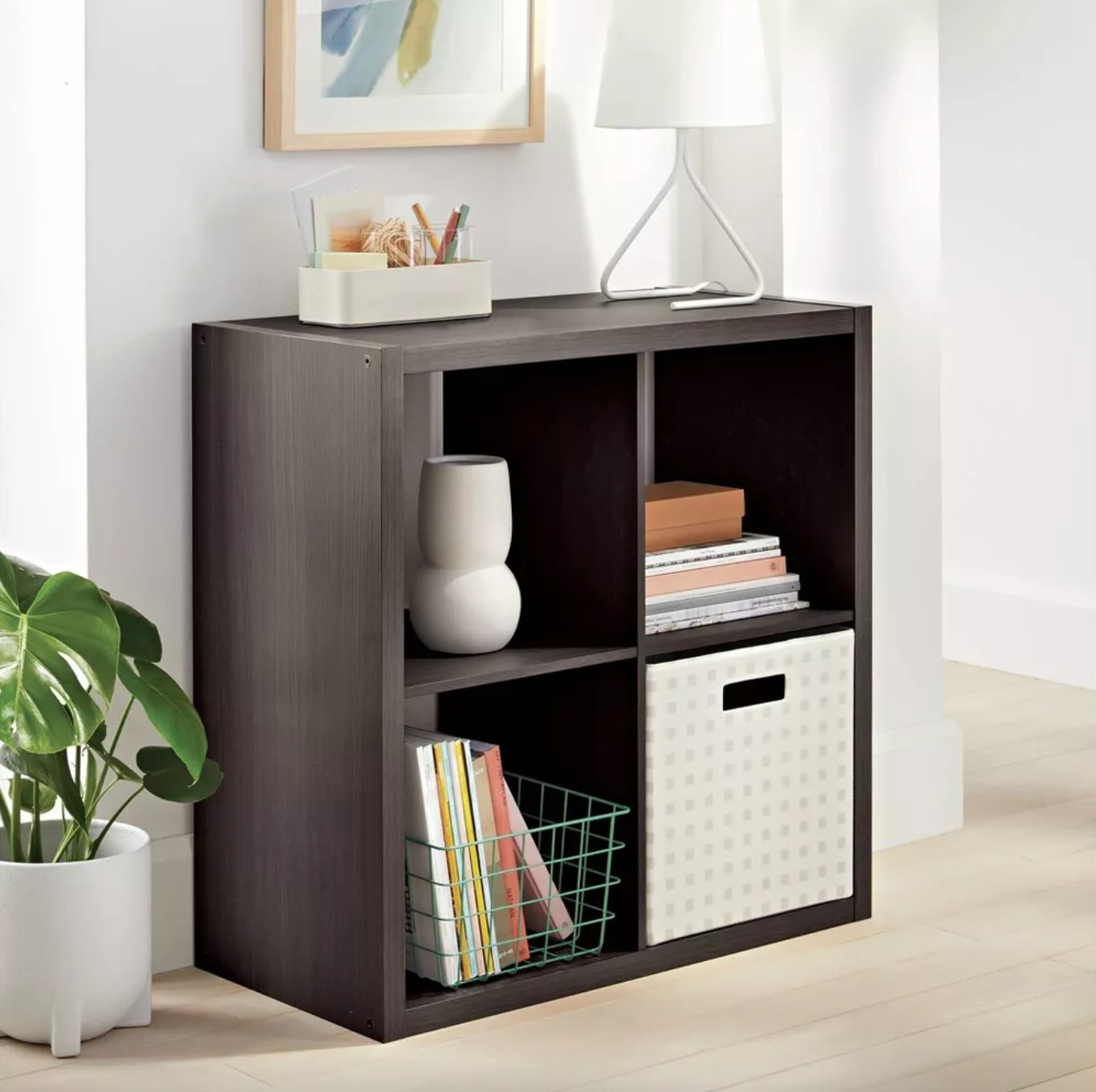 the dark wood four cube organizer in a decorated living space
