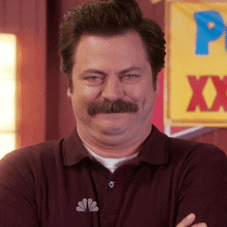 a gif of Ron from Parks and Rec giggling
