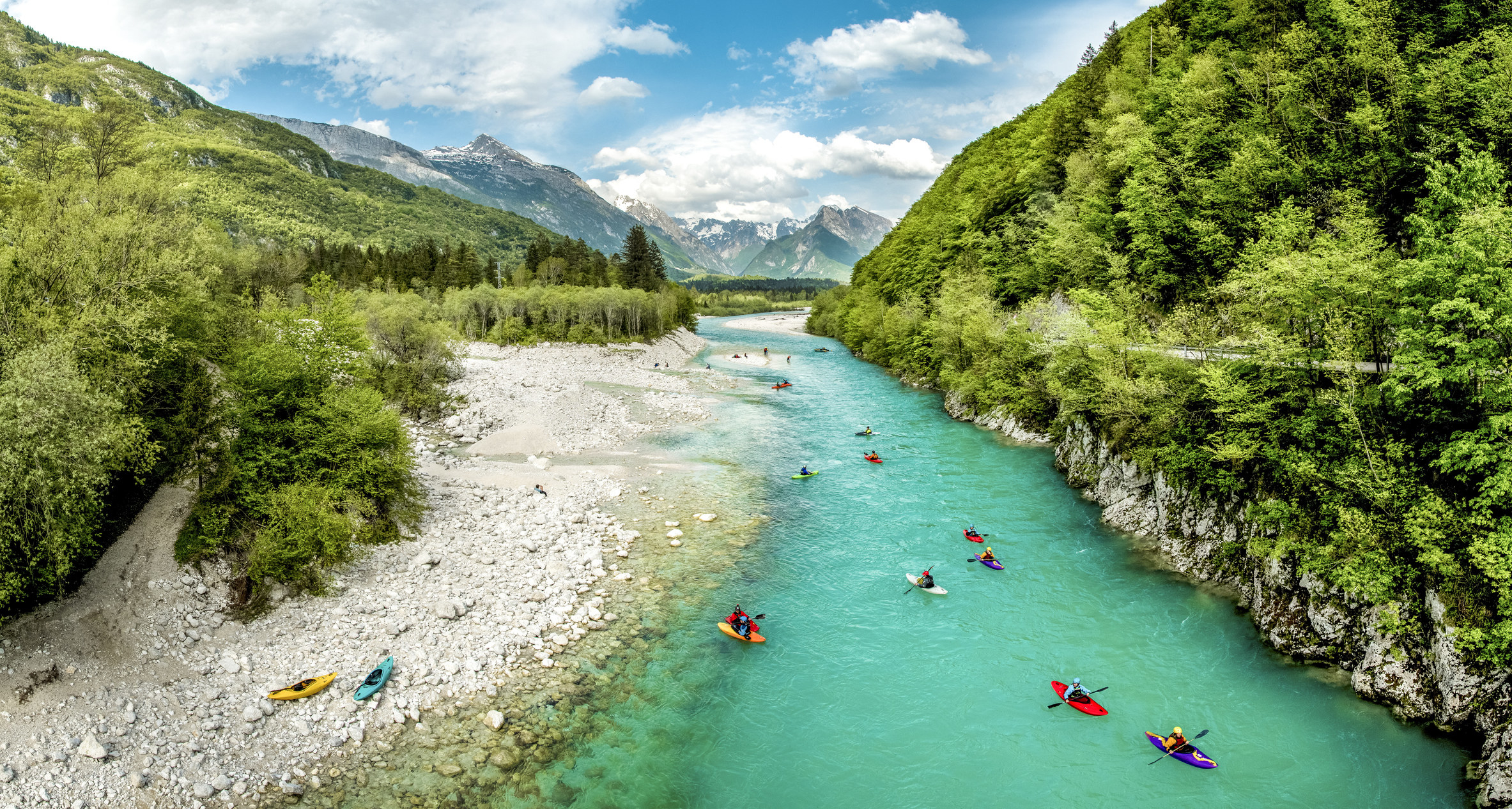 Kayakers on a river in Slovenia