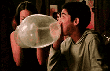 two teens making balloons out of condoms before letting them fly away