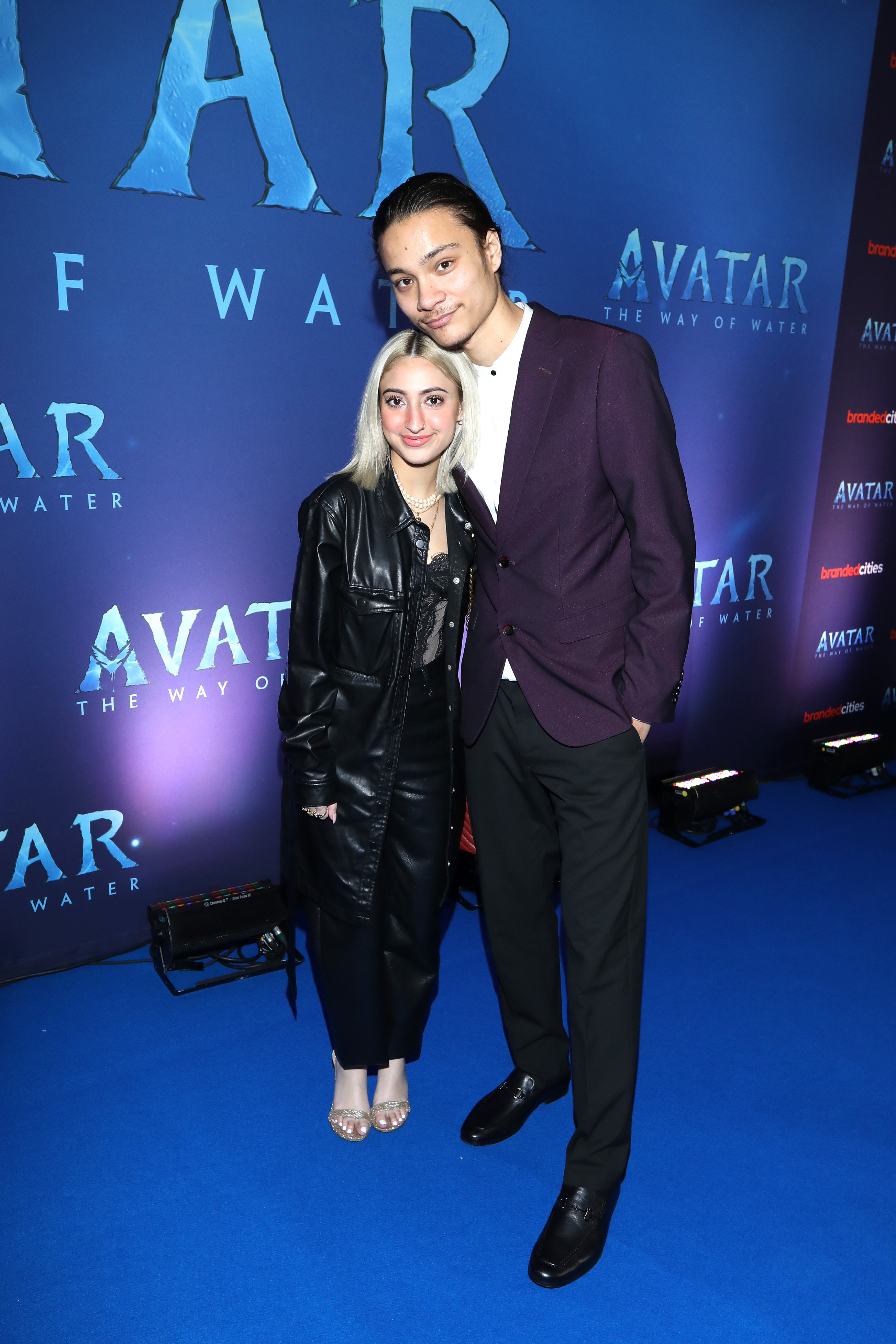 Filip Geljo on the blue carpet with a blonde woman