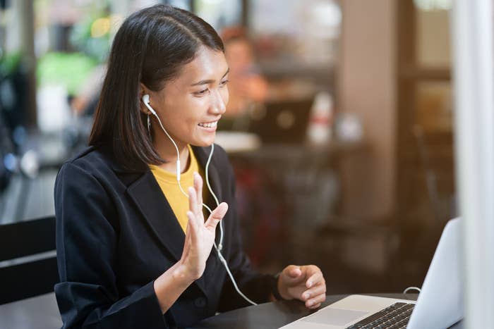 A woman on her laptop with headphones