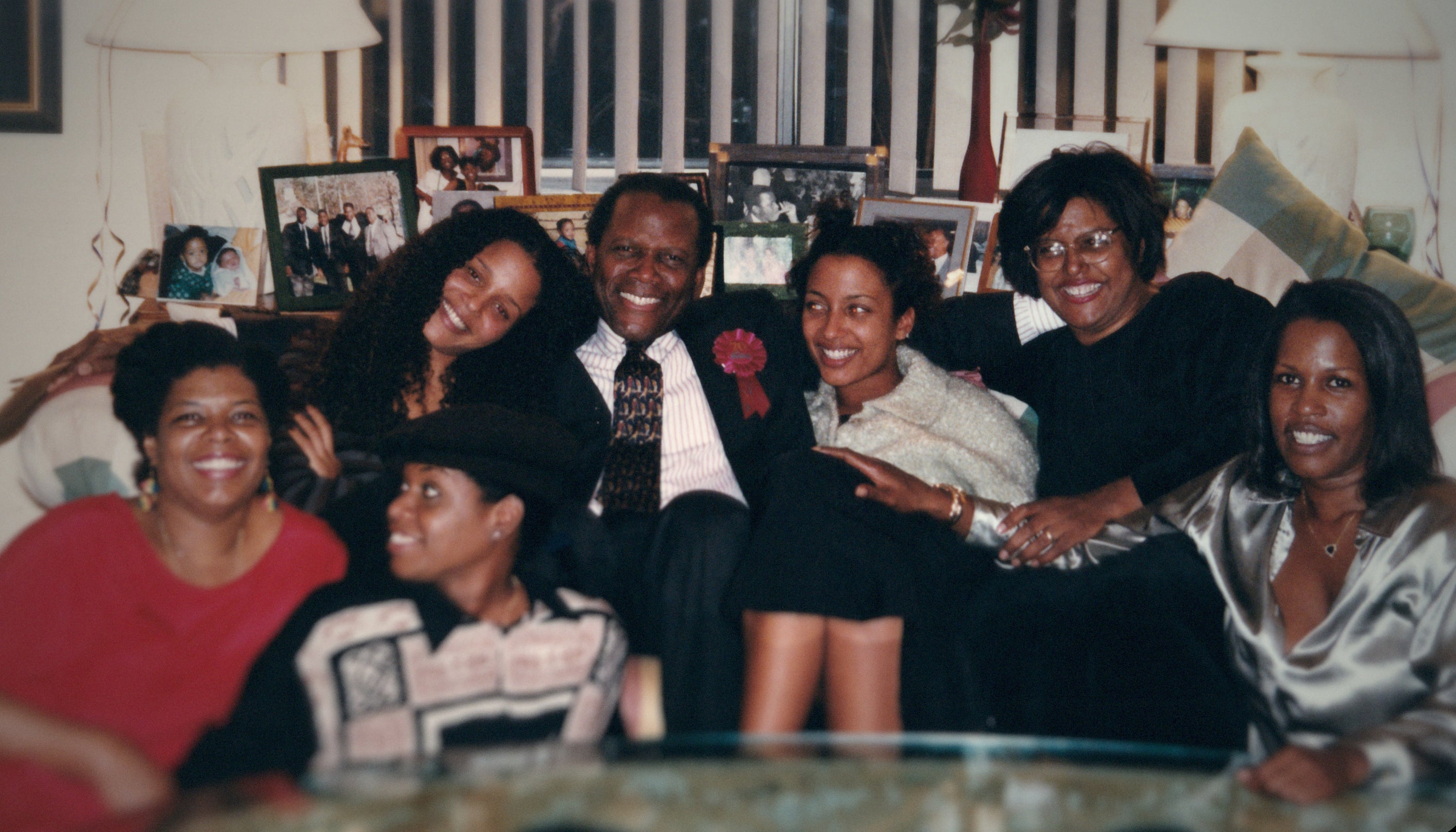 sidney and his daughters at home having a photo taken