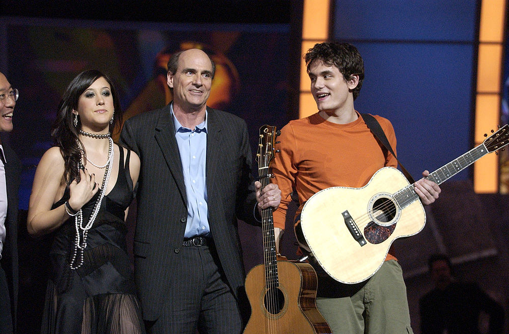 John onstage and looking at Vanessa as they stand with James Taylor and Yo Yo Ma