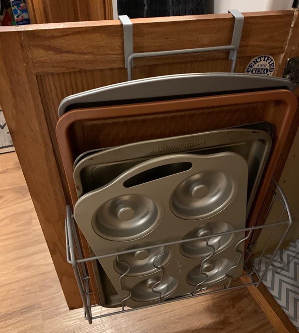 Reviewer image of pans in over the door shelf