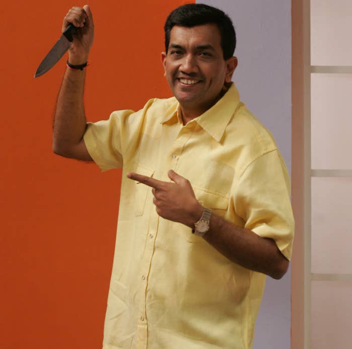 Chef Sanjeev Kapoor holding a knife