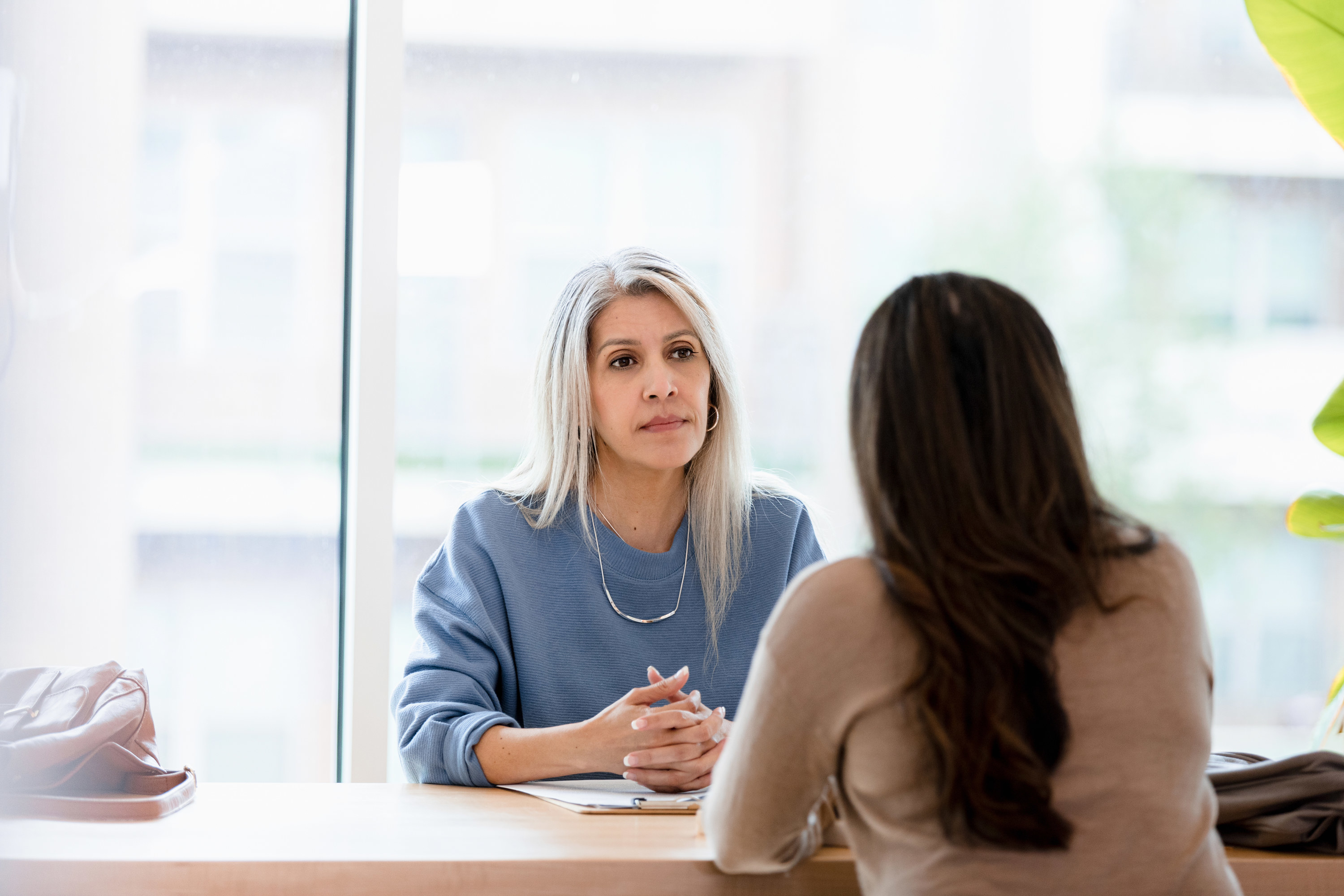 women talking in an office